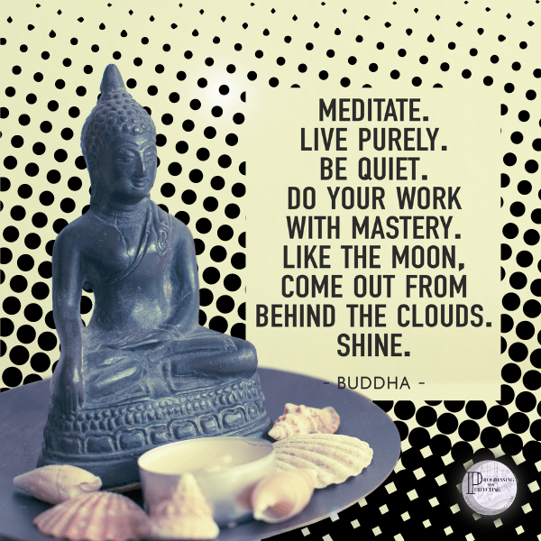 6 a statue of a buddha on a plate with shells and a candle